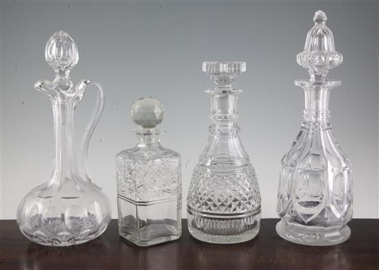 A Victorian cut glass claret jug, two Victorian wine decanters and a square cut glass whisky decanter (4)